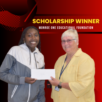  student T'Keira Mack posing with Educational Foundation President Bev Hooper 